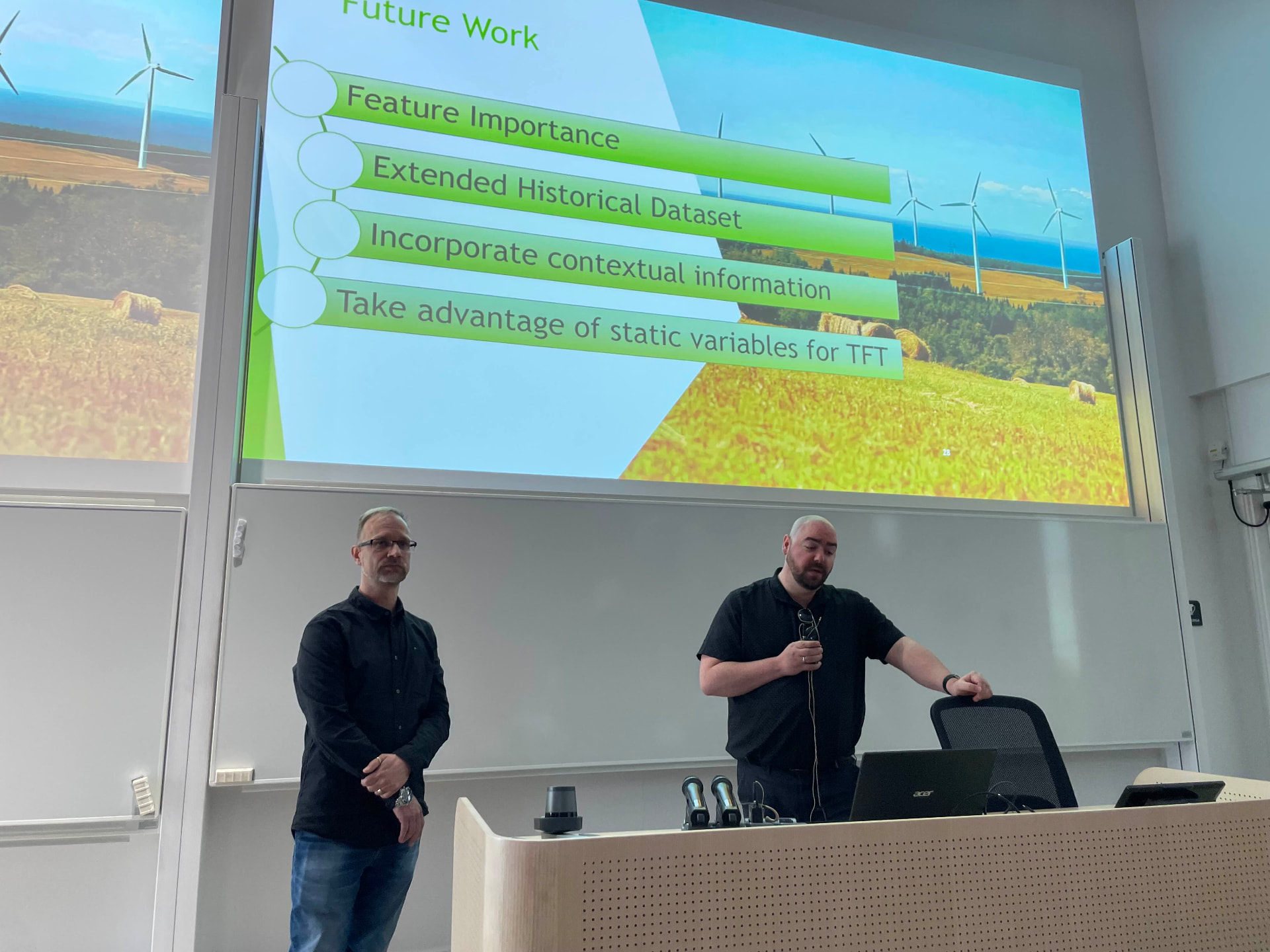 Thesis presentation in a lecture hall with the future-work slide on screen